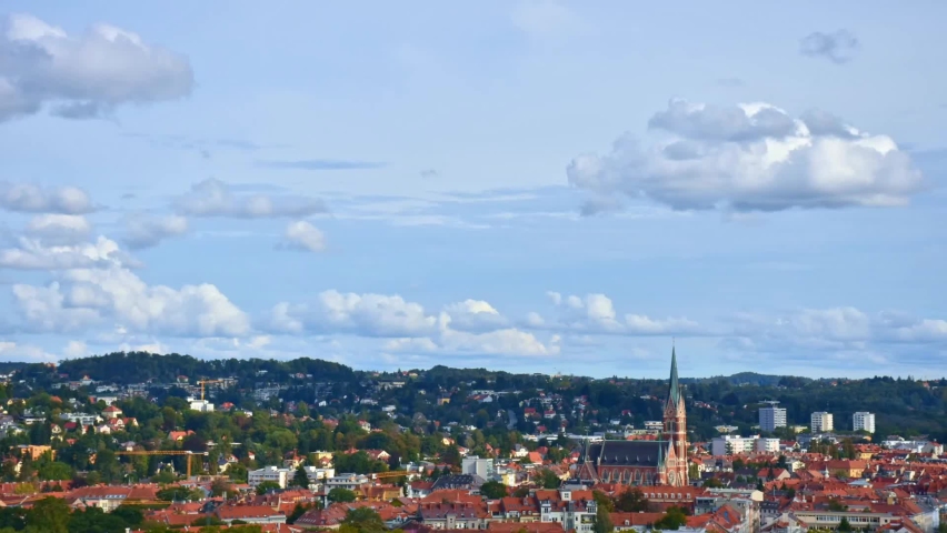 Cityscape of Graz with Church of the Sacred Heart of Jesus and historic buildings 4K timelapse, in Graz, Styria region, Austria