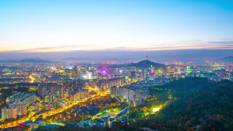 Zoom in,Time lapse Landscape of Seoul South Korea in the morning and the golden sun shines on the city.