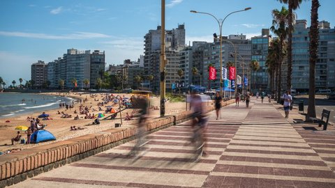 Montevideo, Uruguay - January 16: Time lapse view of people at the Rambla of Montevideo, an avenue that goes all along the coastline of Montevideo, the capital and largest city of Uruguay.