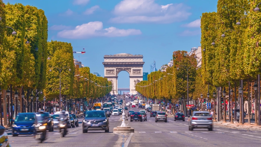 4k timelapse of Paris cityscape, Arch De Triumph (Arch De Triomphe) on Champs Elysees in Paris and the traffic,the most famous landmark in Paris,France.Sunny day in autumn with golden yellow leaves Royalty-Free Stock Footage #1062043621