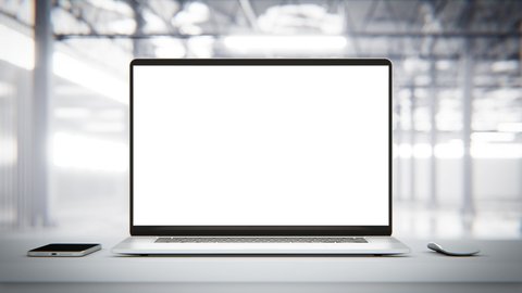 Laptop with blank screen on table smooth zoom in with mouse and smartphone. factory or loft background animation, 4k UHD
