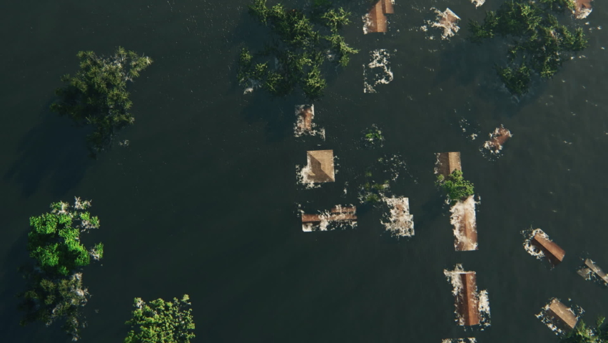 Flight over New Orleans City Flooded, people sitting on roof tops