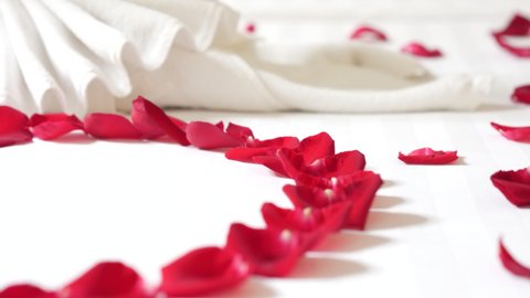 Red Rose in Heart Shape with Swan Towel Design on the Wedding Bed