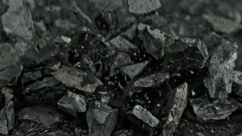 Super Slow Motion Shot of Falling Coal and Black Powder at 1000 fps.