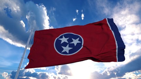 Tennessee flag on a flagpole waving in the wind, blue sky background. 4K