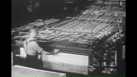 CIRCA 1940s - Linotype machines, printing presses, hand compositing, engraved plates and stacking and sorting are shown in 1947.