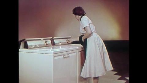 CIRCA 1950s - A disembodied voice helps a housewife visualize a compact kitchen, management center and mending center in a dream world in 1957.