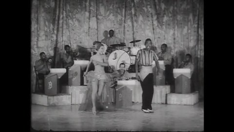 CIRCA 1943 - In this race musical, chorus girls dance to live Latin American music at a nightclub.