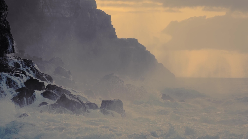CIRCA 2020 - Extreme slow motion of beautiful ocean waves crashing into Kaiaka Rock, Molokai Hawaii suggests refreshment, beauty, and nature. Royalty-Free Stock Footage #1062068689