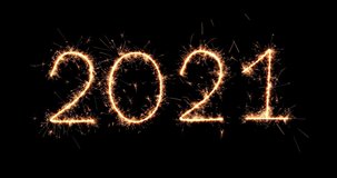 2021 sparkling numbers on black background. Flicker light. 4K graphic animation. Golden color bright animation numerals of the New Year glowing. Holiday neon banner. New year's sign