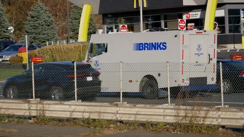 Brinks armored security car transfers money from local business merchants to banks, Rt.1 Saugus Massachusetts USA, November 6 2020
