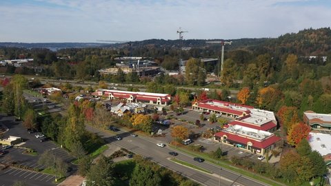 Aerial / drone footage of Issaquah, Olde Town, Newport, the I-90 highway, commercial area, Lake Sammamish and surrounding suburbs in King County, Washington