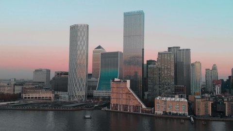 Rising Drone aerial shot of London Canary Wharf at sunset