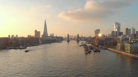 dolly forward drone shot London city centre tower bridge shard gherkin at sunset