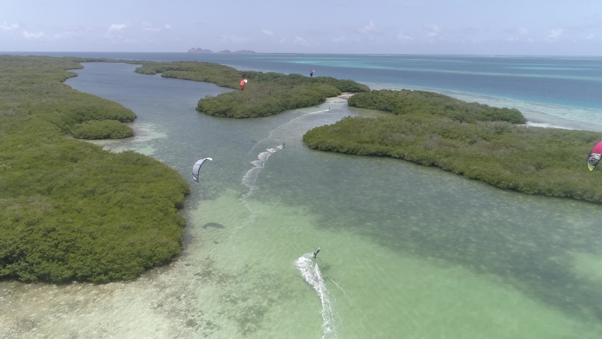 Aerial View kitesurfer of caribbean sea in esparky lagoon Los Roques, Venezuela. Kitesurfing