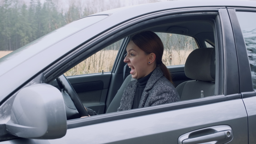 Stuck in car. Driving is boring. Stuck in a traffic jam. Person in a traffic jam. Get stuck in a traffic jam.