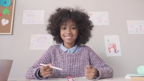 Happy african american kid child girl school student looking at web cam talking with remote teacher distance learning video conference call virtual class lesson, headshot zoom portrait, webcam view. - Powered by Shutterstock - Get 15% off with code: PIKWIZARD15