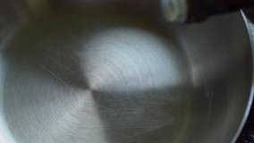 Pouring olive oil into a frying pan.
Close up of Pouring vegetable oil into a wok. - Powered by Shutterstock - Get 15% off with code: PIKWIZARD15