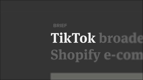 NYC, USA - Oct 10, 2020: TikTok in the headline in worldwide news website and media. Chinese application in newspaper. Economy financial and technology concept b-roll footage. Logo zoom in