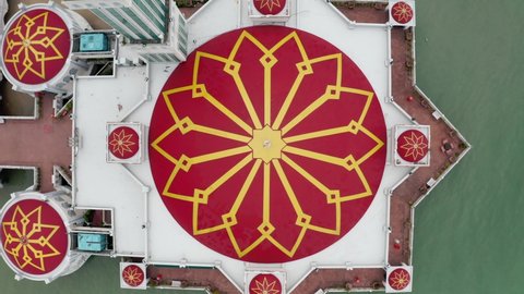 Penang Island , Penang / Malaysia - 12 14 2019: Tanjung Bunga floating mosque roof dome is seen from above with red and yellow details