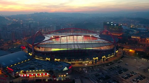 Lisbon / Portugal - 01 18 2020: Aerial, orbit, drone shot, around the Benfica stadium, colorful dusk, on a sunny evening, in Lisbon, Portugal