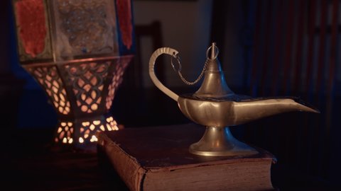 A genie concept, rubbing a magical lamp with a genie coming out.
Actual old oil lamp from Morocco.
