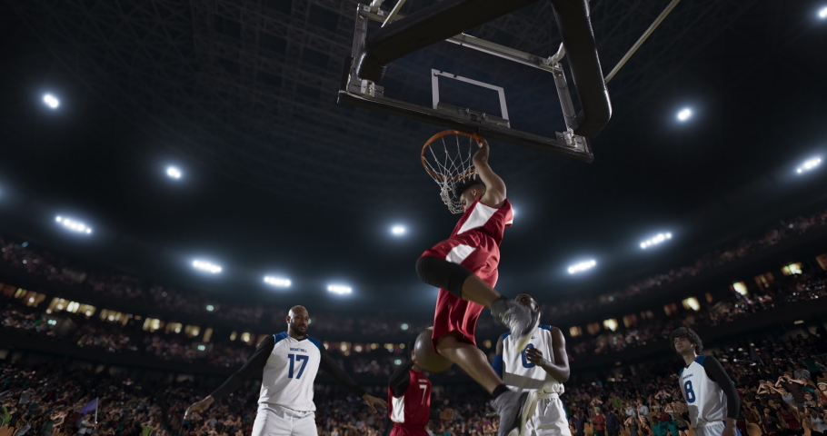 Basketball players on big professional arena during the game. Tense moment of the game. View from below the basket Royalty-Free Stock Footage #1062109078