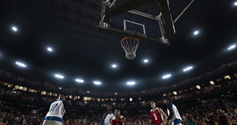 Basketball players on big professional arena during the game. Tense moment of the game. View from below the basket Royalty-Free Stock Footage #1062109084
