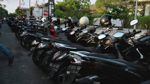 Kuta, Kabupaten Badung, Bali, Indonesia - 6, November 2020: Lots of motorcycles standing in the parking lot in the line