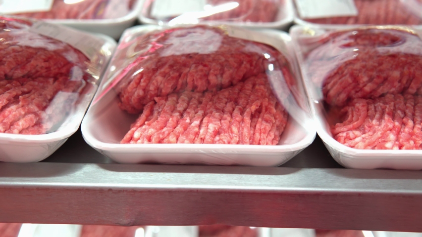 Minced meat in the store close-up. sale of fresh meat in a supermarket | Shutterstock HD Video #1062114505