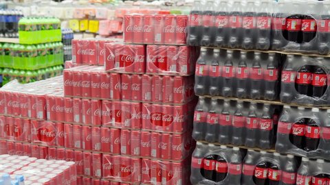 Tyumen, Russia-November 07, 2020: Coca-Cola in packages in a large wholesale hypermarket. Coca-Cola is a carbonated soft drink produced by the Coca-Cola Company.