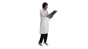 Female medical doctor reading x rays of patients brain on white background. - Powered by Shutterstock - Get 15% off with code: PIKWIZARD15