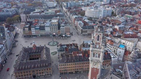 France, North, Lille, Général De Gaulle Grand-Place, drone aerial view starting from the belfry of the chamber of commerce and ending above the square.