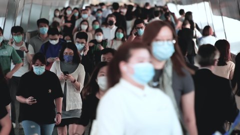 Hong Kong / China - 11 09 2020: Hong Kong - October 24, 2020: Unrecognized people wearing medical face masks in Hong Kong. Covid-19 concept.
