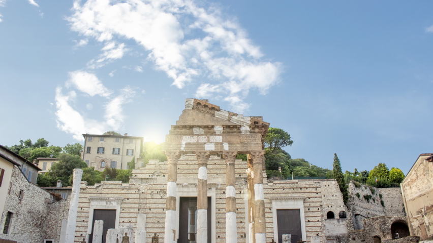 Time lapse of The ruins of the Capitolium or Temple of the Capitoline Triad in Brescia, Italy during a sunny cloudy day. , main temple in the center of the ancient Roman town of Brixia