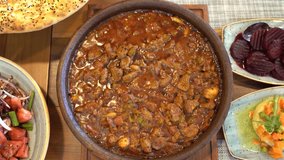 Saute meat in casserole. Meat Saute Turkish Et sote, turkish cuisine. Turkish name; Guvec. Food preparation stage video.