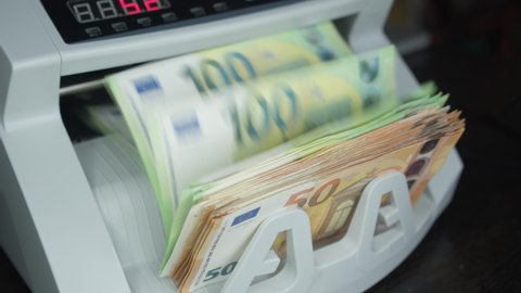 Counting Euro banknotes an electronic money counter European Union Currency