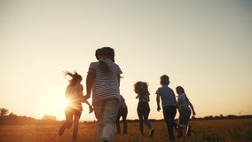 happy family. children kid together run in the park at sunset silhouette. people in the park concept. happy family joyful run. happy family and fun little baby child summer kid dream concept - Powered by Shutterstock - Get 15% off with code: PIKWIZARD15