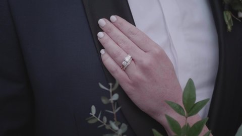 Bride with Hand on Groom and Wedding Ring