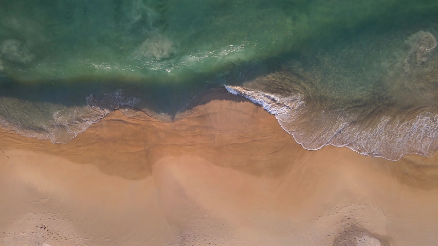 (Top view) Aerial view drone over beach sea. Beautiful sea waves. Beach sand and amazing sea. Summer sunset seascape. Phuket Thailand Beach. Water texture. Top view of the fantastic natural sunsets Royalty-Free Stock Footage #1062136492