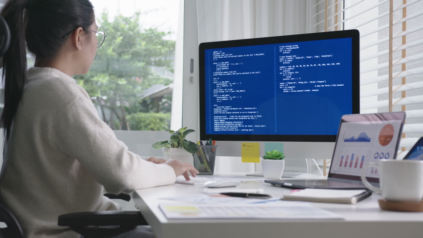 Side view of young asian woman, freelance data scientist work remotely at home coding programing on Big data mining, AI data engineering, IT Technician Works on Artificial Intelligence Project. Royalty-Free Stock Footage #1062141535
