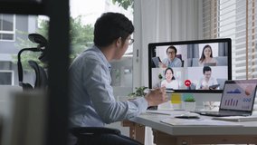Tracking : business man talking about sale report in video conference.Asian team using laptop and tablet online meeting in video call.Working from home, Working remotely and Self isolation at home