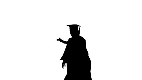 Silhouette Male graduate in robe and mortarboard doing modern dance with arms in the air looking at camera.