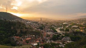 4K Day to night Time Lapse video of Tbilisi cityscape skyline 