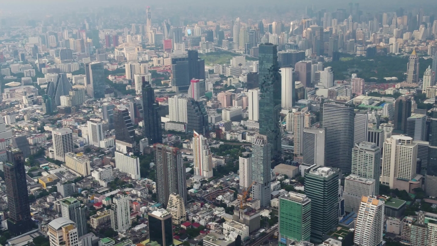 Bangkok, Thailand, flies high between skyscrapers  District with city views. Royalty-Free Stock Footage #1062147829