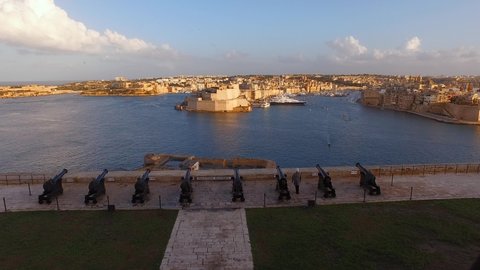 Valletta / Malta - 11 18 2019: Saluting Battery, Valletta, Malta. Firing The Cannon For The Saluting shot, high angle view from Barakka Gardens