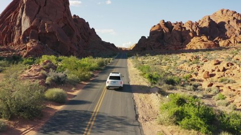 Nevada / United States - 05 25 2019: White Rolls Royce on the open road in the Valley of Fire