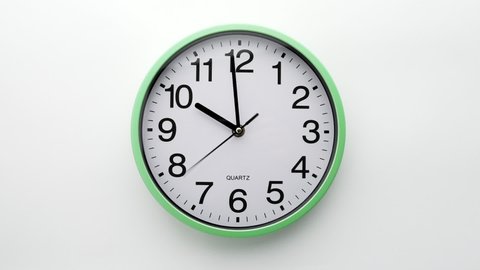 Wall clock timelapse. White background. From ten to half past three