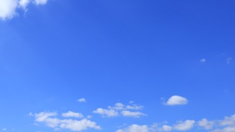4k Blue sky white clouds. Puffy fluffy white clouds.Cumulus cloud cloudscape timelapse. Summer blue sky time lapse. Nature weather blue sky. White clouds background. Cloud time lapse nature background