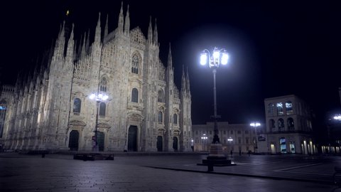 The Duomo Cathedral and Vittorio Emanuele Gallery are empty at night of people - localization of the Covid-19 coronavirus epidemic in the red zone of Lombardy. Lanterns. Milan Italy, November 2020: